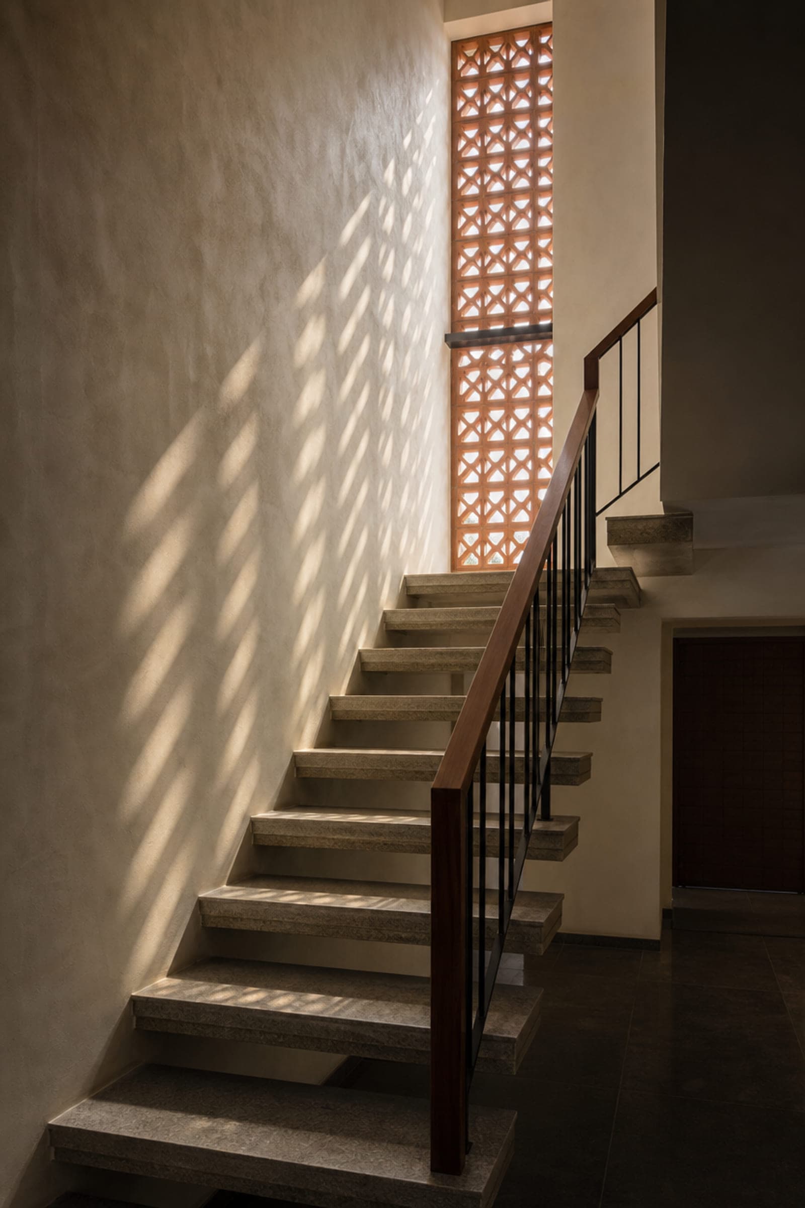Detail of a finished stair and handrail in a completed residence