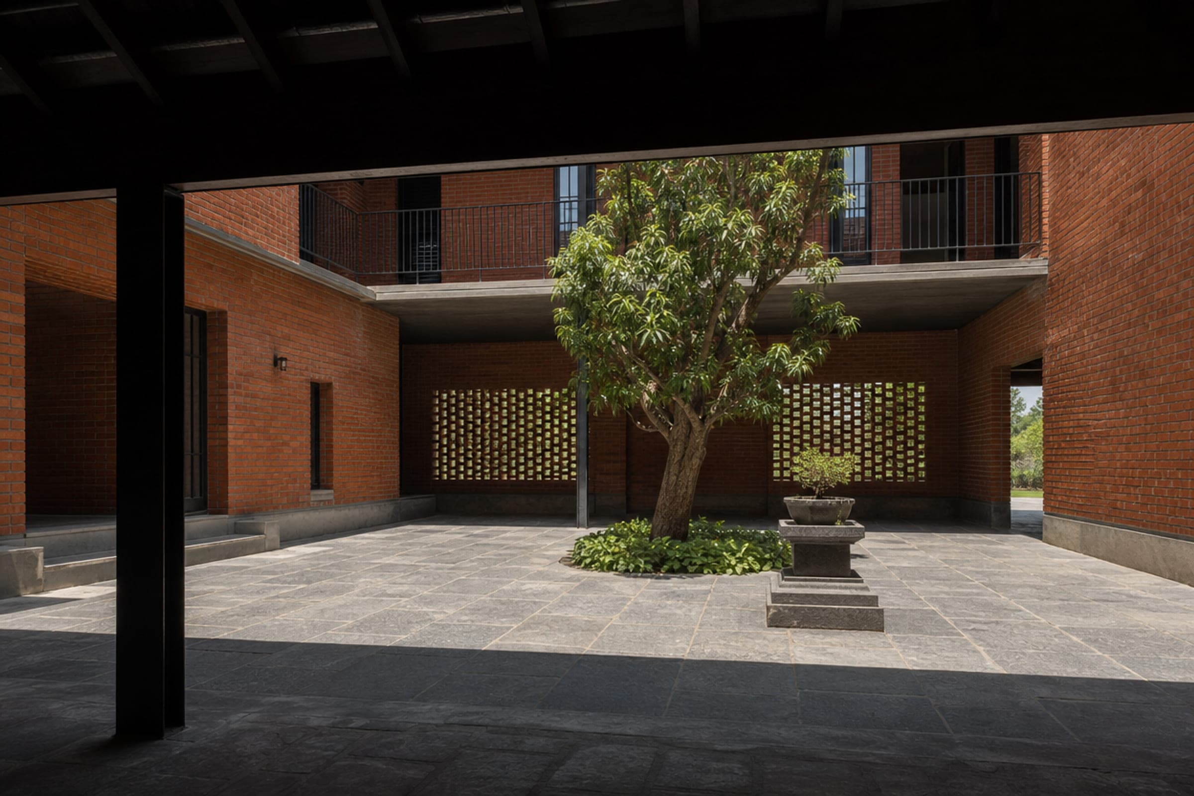 Open-to-sky courtyard seen from a shaded verandah