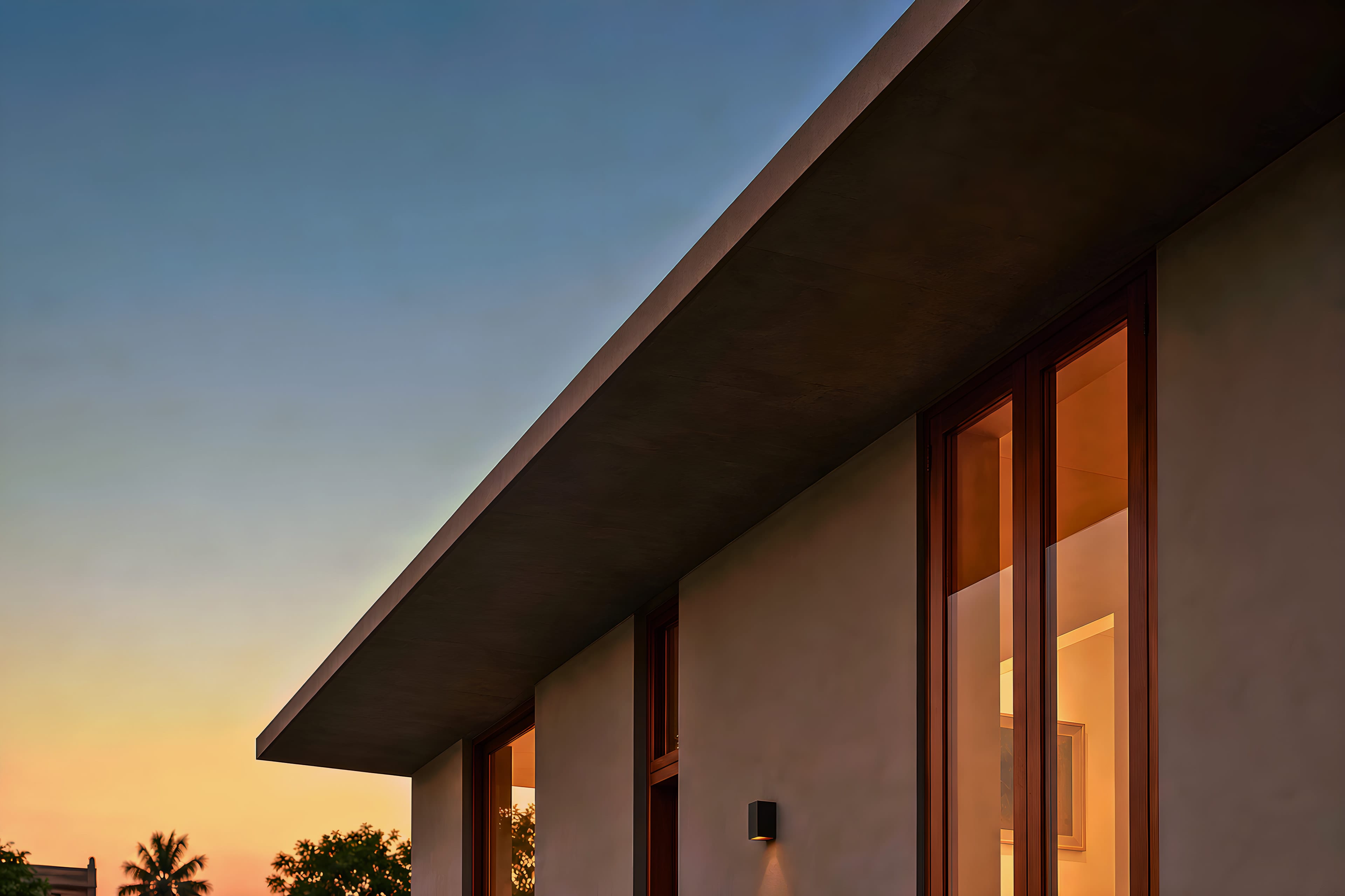 Dusk light across the eaves of a newly finished house